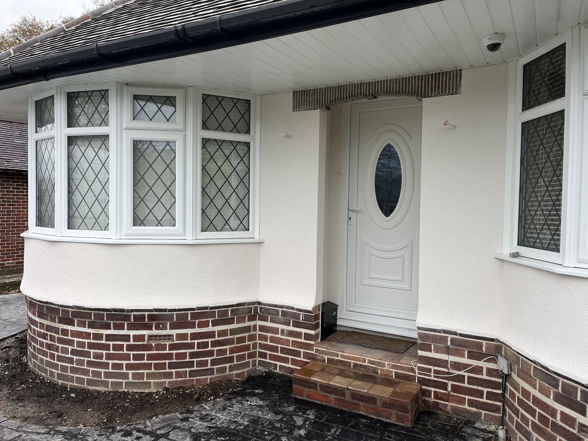 Bungalow bay front freshly finished in white render